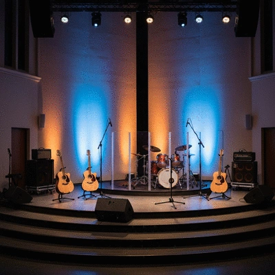 Modern church interior with stage lighting and musical instruments