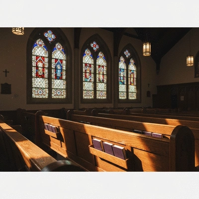 Traditional Lutheran church interior with sunlight through stained glass