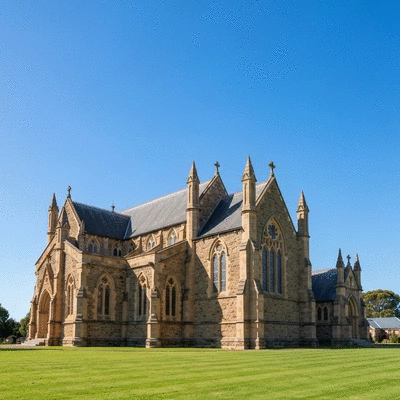 Exterior view of a Victorian Gothic stone church in Australia with pointed arches