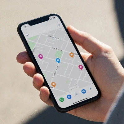 Person using a smartphone to find local church locations on a map
